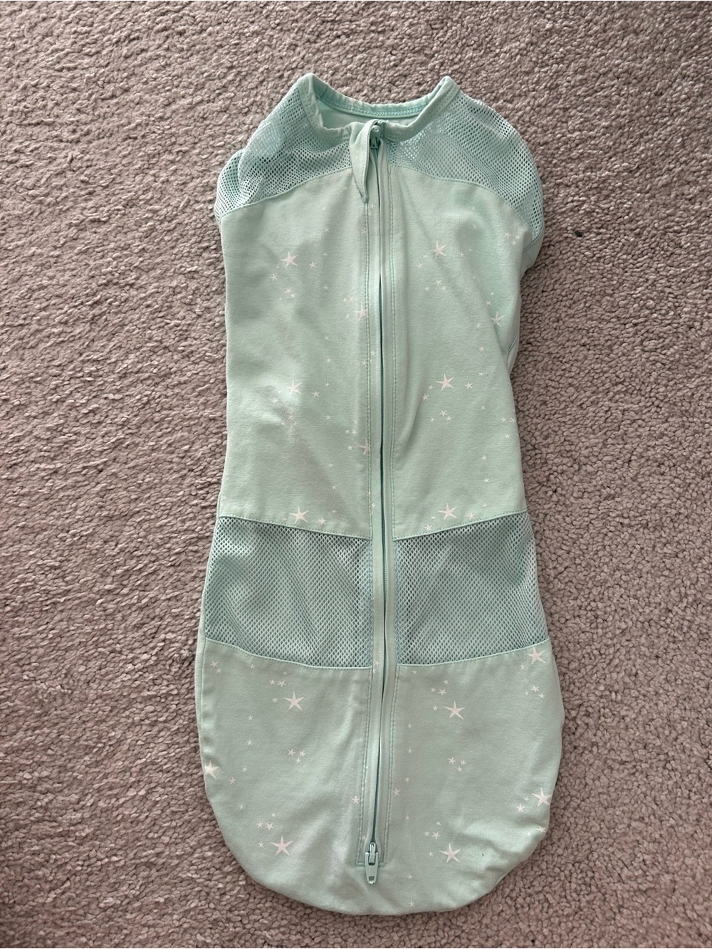 Happiest Baby Sleepea 5-Second Swaddle in a light green "Teal Stars"
